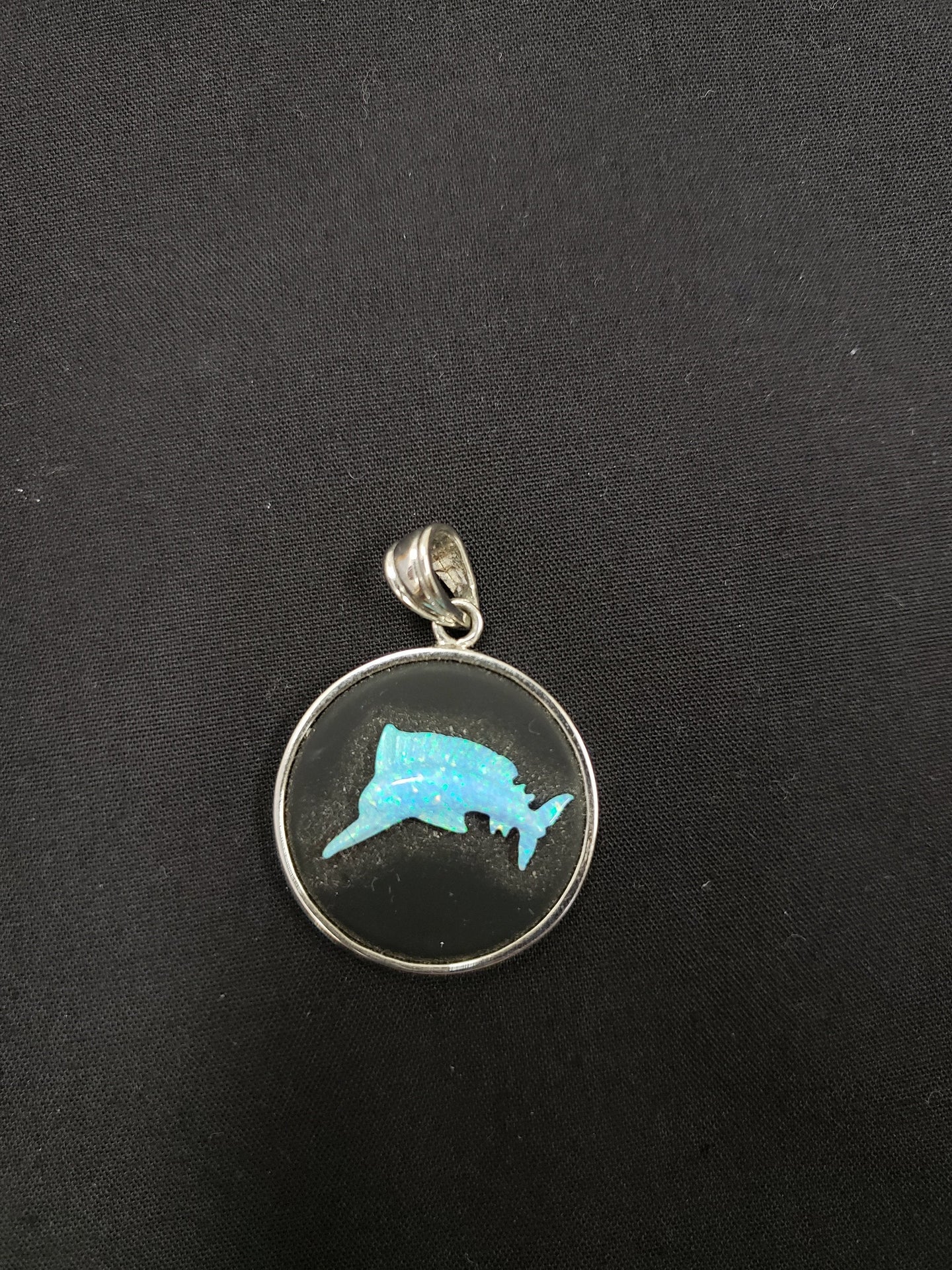 carving marlin fish Blue fire opal  sterling silver round pendant