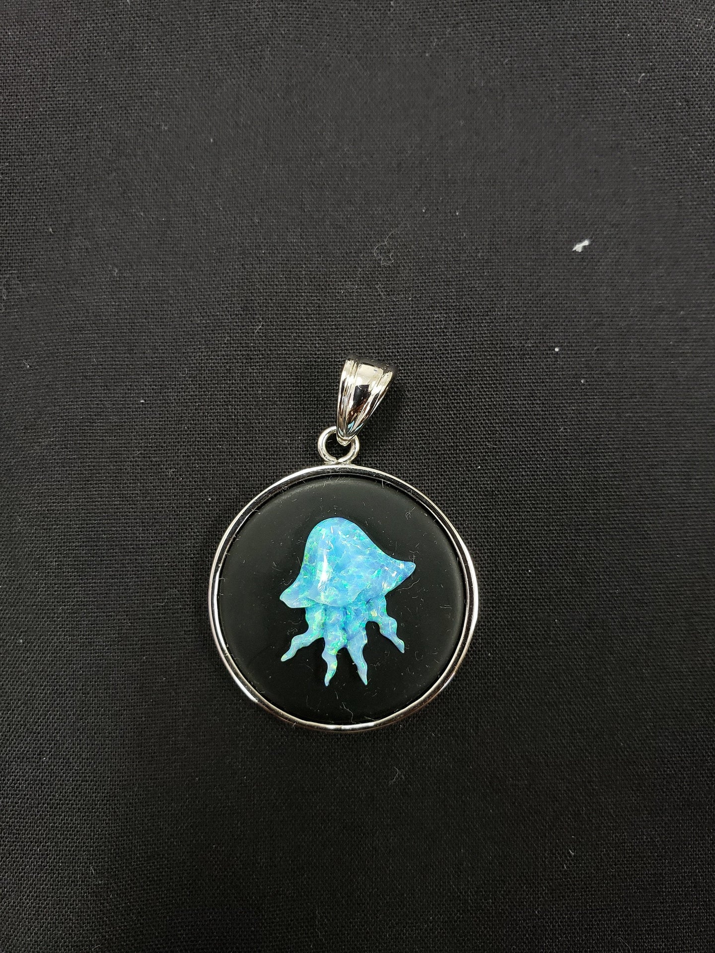 carving jellyfish Blue fire opal  sterling silver round pendant