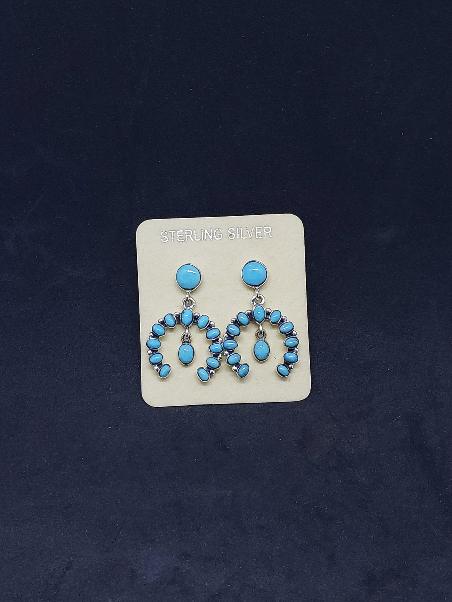 Southwest Naja sleeping beauty turquoise sterling silver dangle earrings