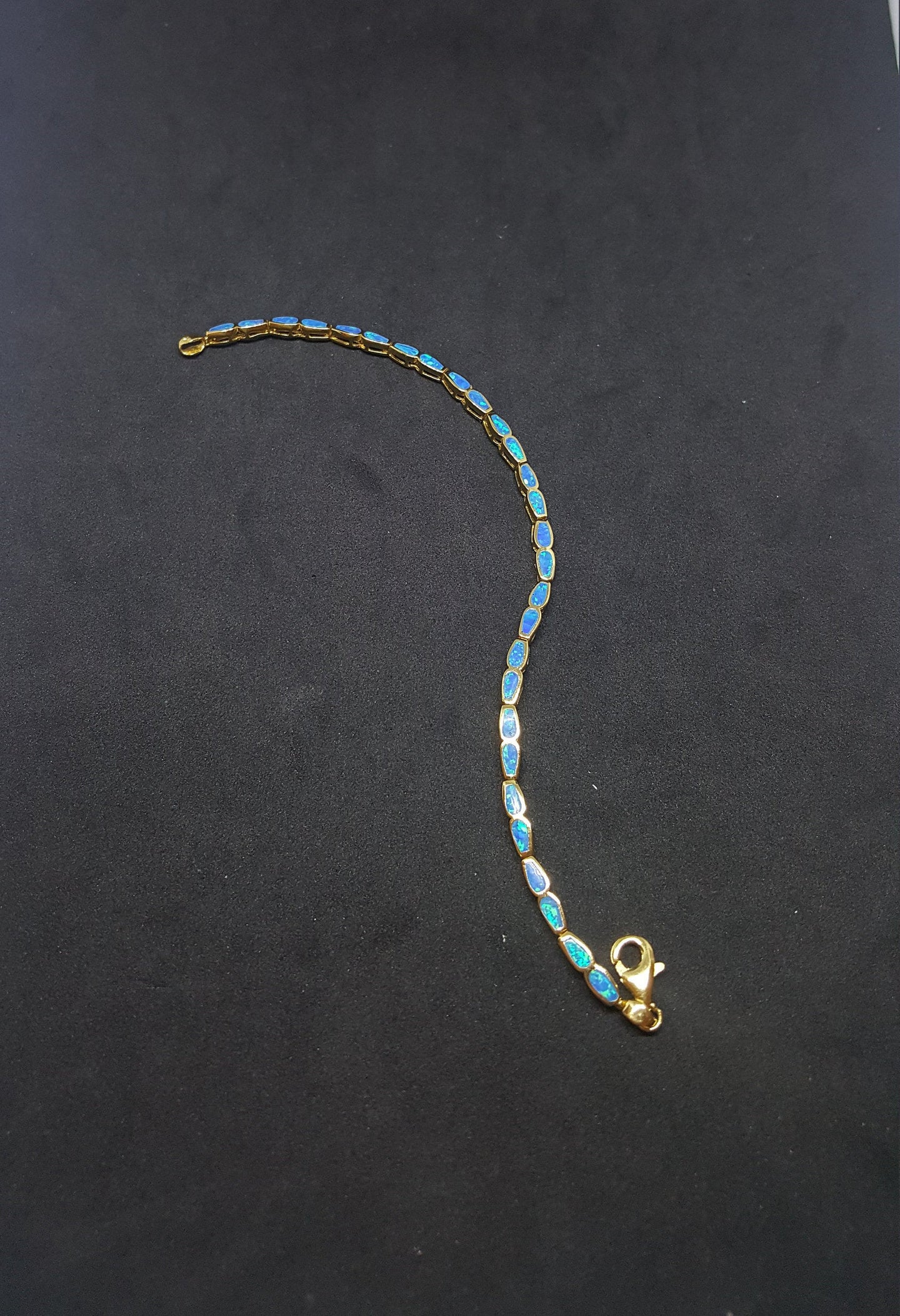 Small rectangle Blue Fire Opal gold plated sterling silver chain bracelet