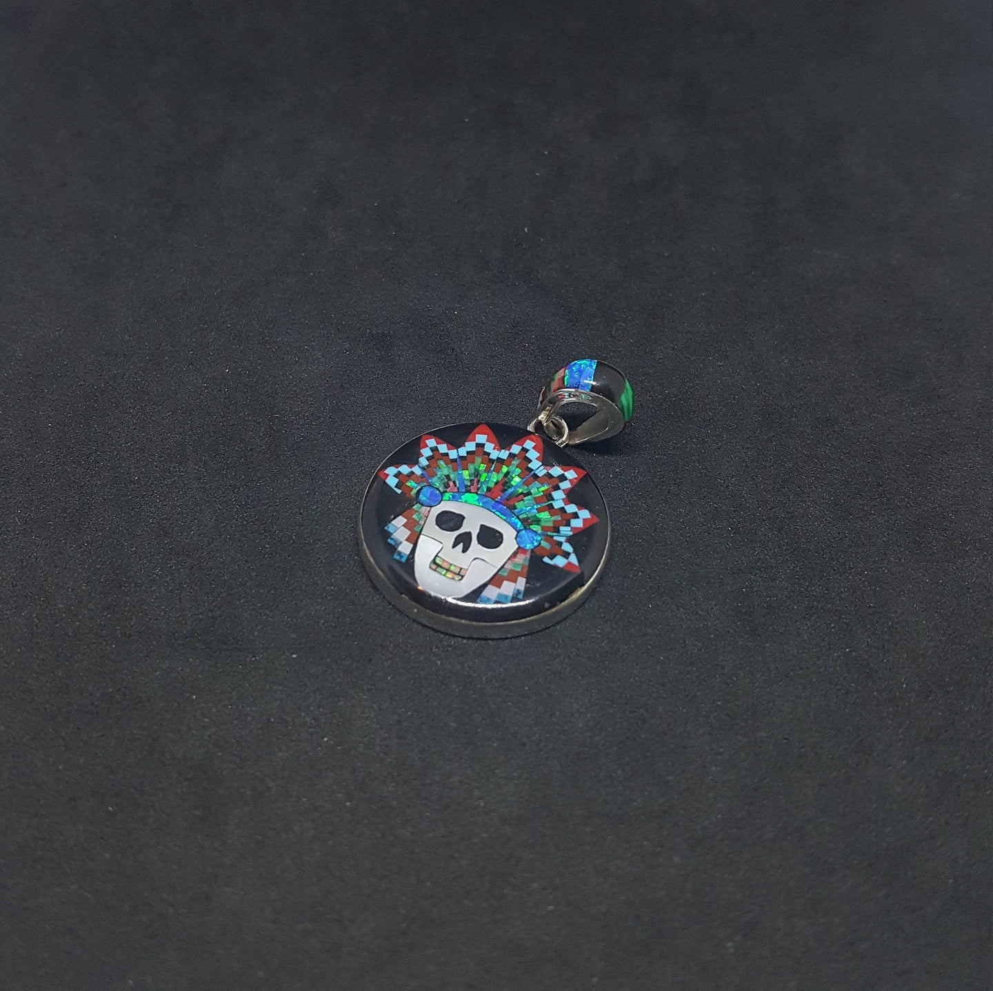 Galaxy skull chief head with colorful feather hat inlay black onyx mother of pearl fire opal coral turquoise sterling silver pendant