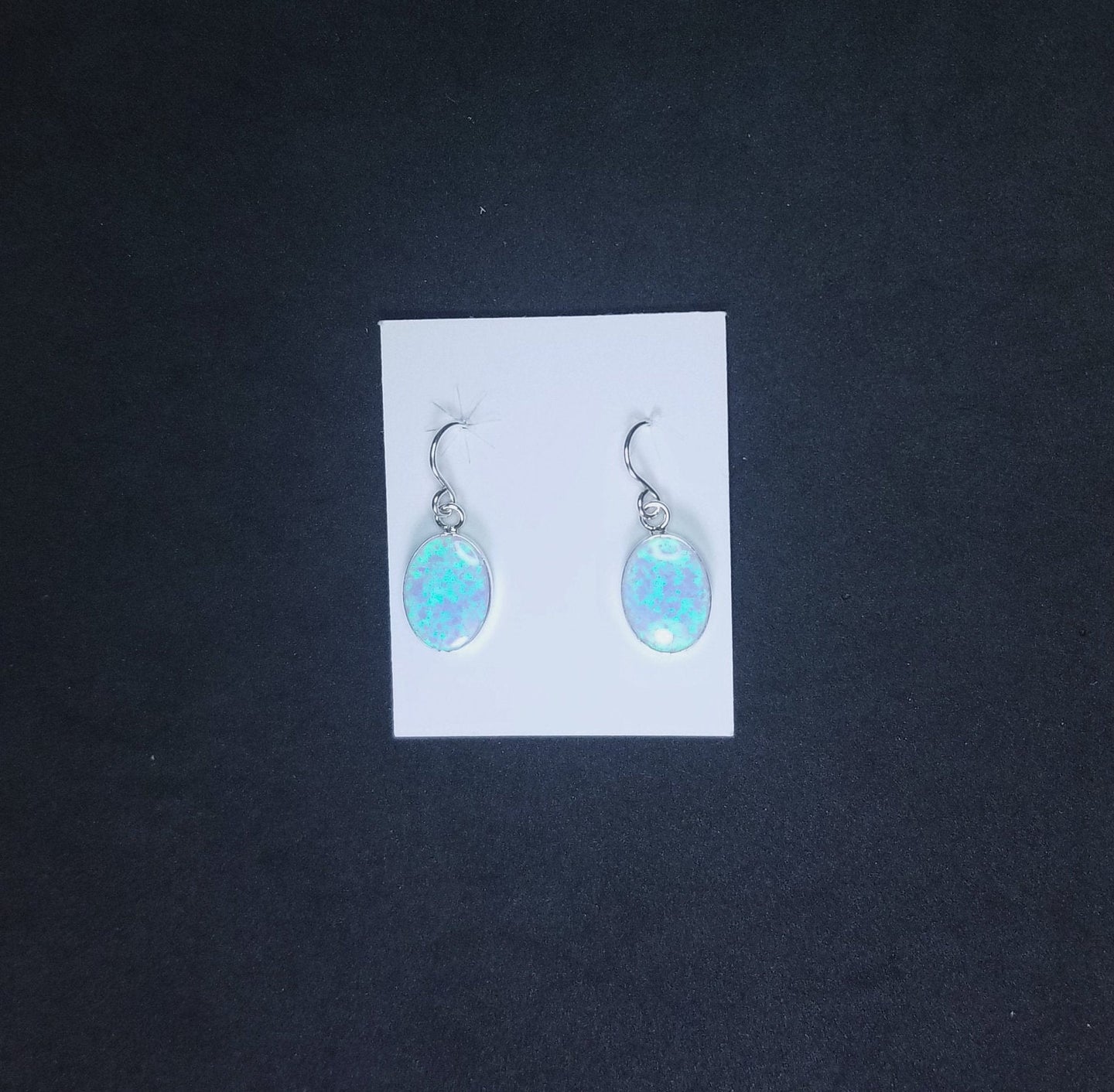 Oval Light Blue Fire Opal sterling silver dangle earrings